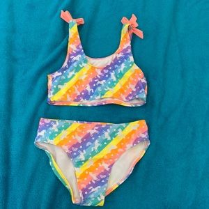 This is a cute unicorn swimsuit and L (10/12)